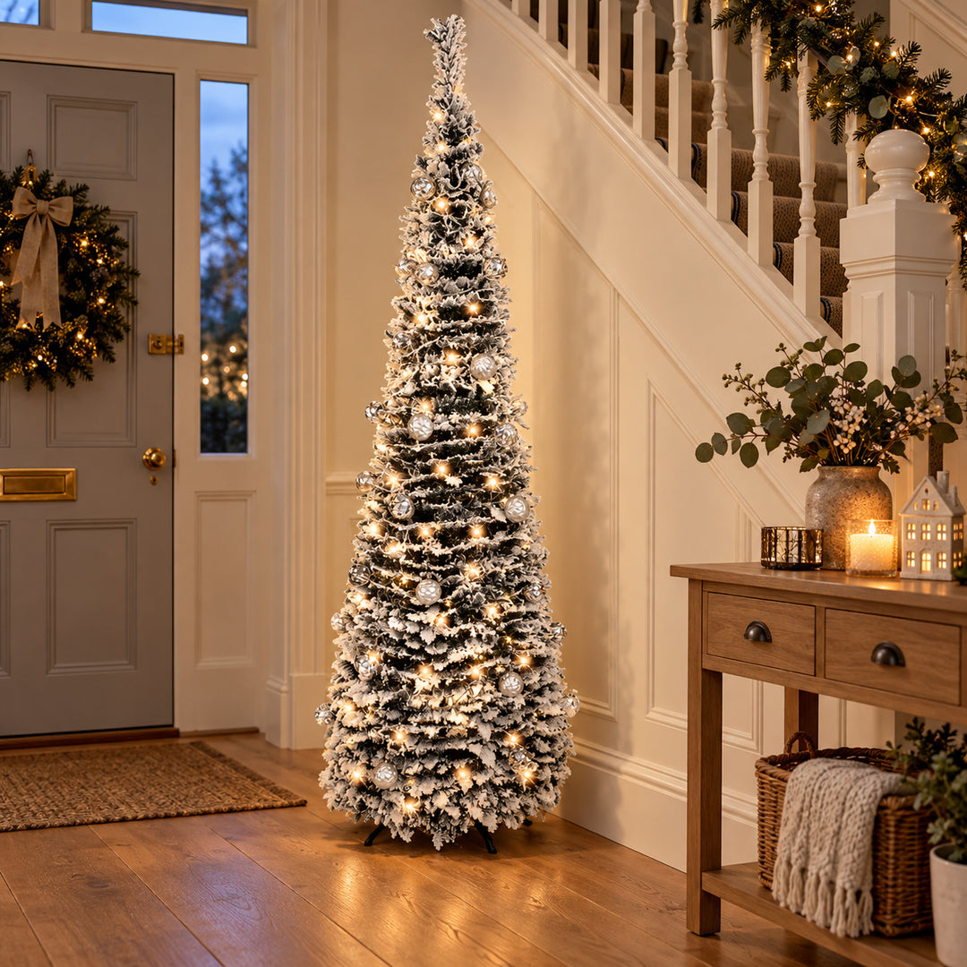 6ft frosted pop-up Christmas tree with warm white lights in a British hallway