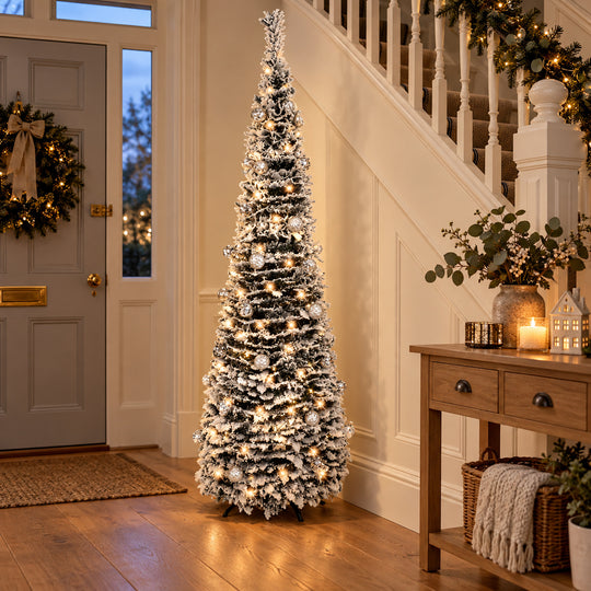 6ft frosted pop-up Christmas tree with warm white lights in a British hallway