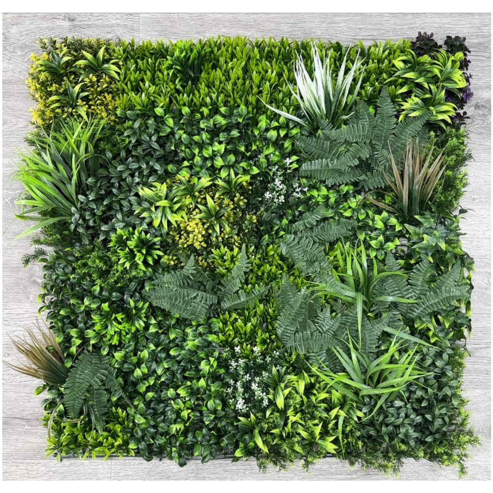 A 100cm x 100cm artificial green wall mat designed for both indoor and outdoor use, featuring a variety of artificial plants.